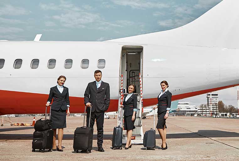 A luxury vehicle for airport chauffeur services parked outside an airport terminal in London, dropping the client. Moreover. the vehicle is clean and sleek.